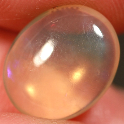 SOLID CRYSTAL OPAL Transparent with purple moving within
